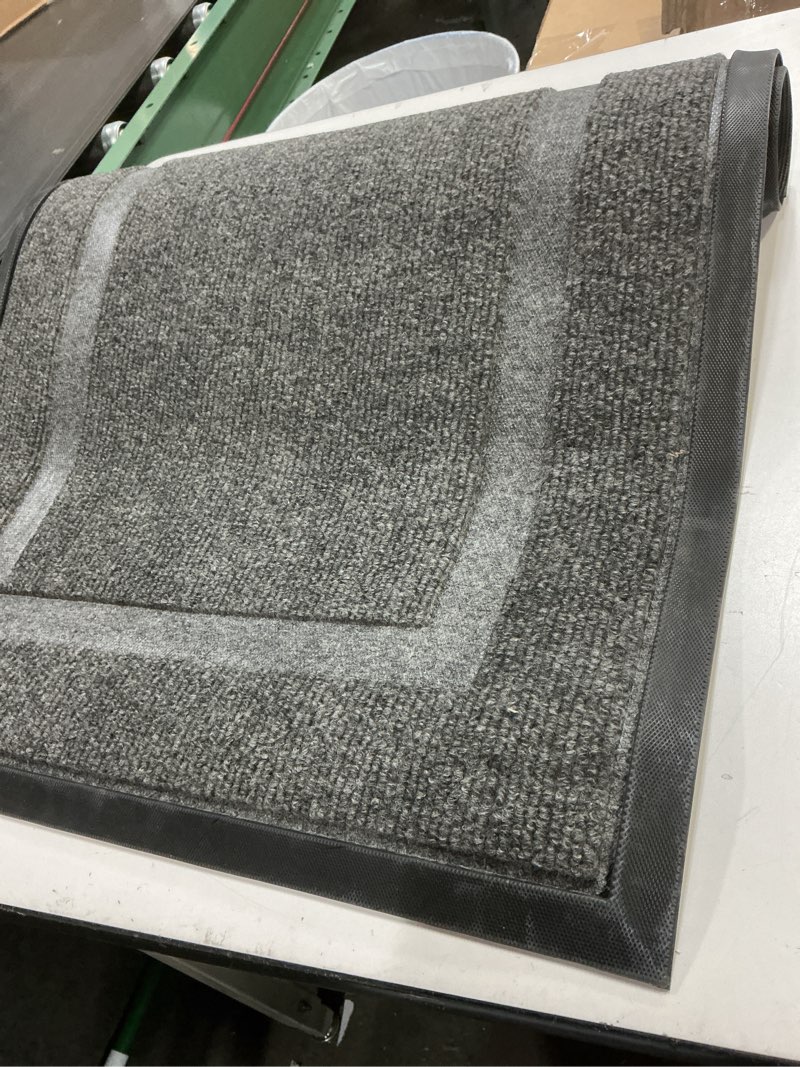 Condition photo showing As Is for OLANLY Front Door Mat Indoor Outdoor Entrance, Waterproof All-Season, All-Weather Doormat, Sturdy Natural Rubber, Fade Resistant, Low Profile, Easy Clean Patio Porch Entryway Mat, 35x23, Dark Grey Dark Grey Classic Border Rectangular 35" x 23"