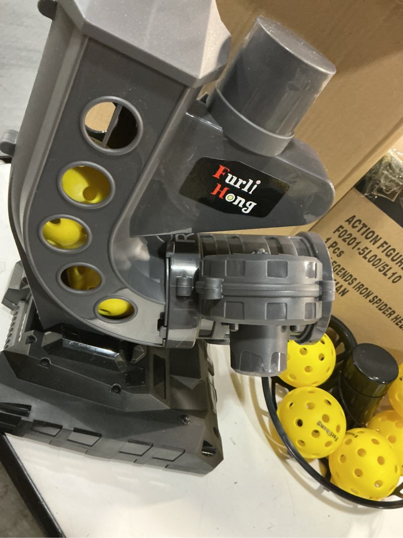 Condition photo showing As Is for furlihong 388pbh pickleball machine, 4 adjustable angles, includes 9 pickleballs, powered by power bank/battery, for beginners
