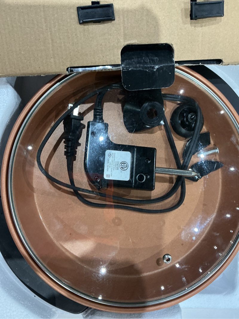 Condition photo showing As Is for ovente electric skillet and frying pan, 12 inch round cooker with nonstick coating, 1400w power, adjustable temperature control, tempered glass lid with vent and cool touch handles, copper sk11112co