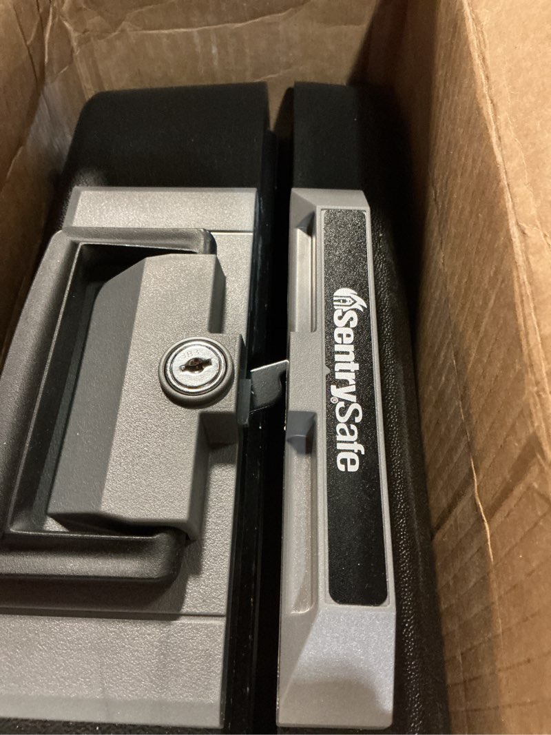 Condition photo showing As Is for sentrysafe fireproof safe box with key lock, chest safe with carrying handle to secure money, jewelry, documents, 0.25 cubic feet, 6.3 x 15.3 x 12.1 inches, 1160