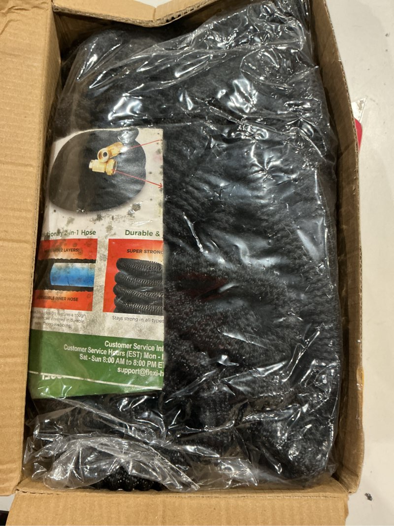 Condition photo showing As Is for flexi hose expandable garden hose with 8 function nozzle, 75ft - lightweight retractable garden hose, water hose - no-kink flexibility, 3/4 inch solid brass fittings and double latex core 75ft black