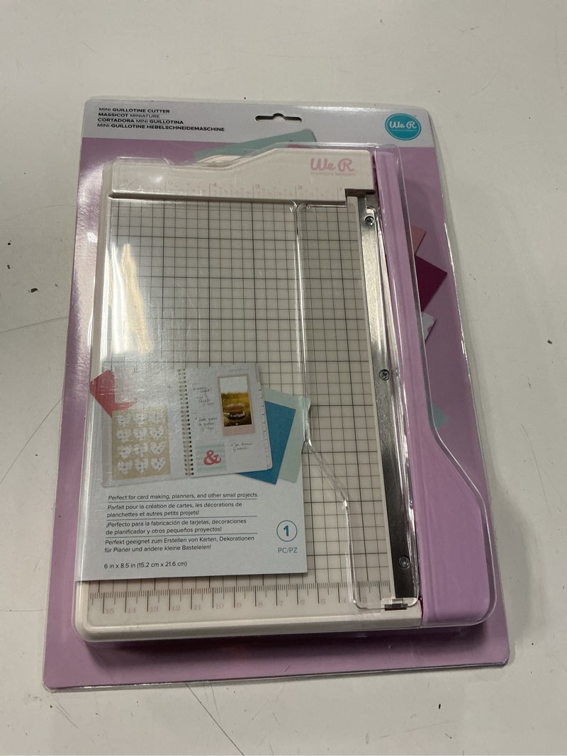 Condition photo showing Good Condition for we r memory keepers mini guillotine paper trimmer – lilac, compact paper cutter, 1/4-inch grid for precision cutting, cuts up to 3 sheets, perfect for card making, journals, and small craft projects