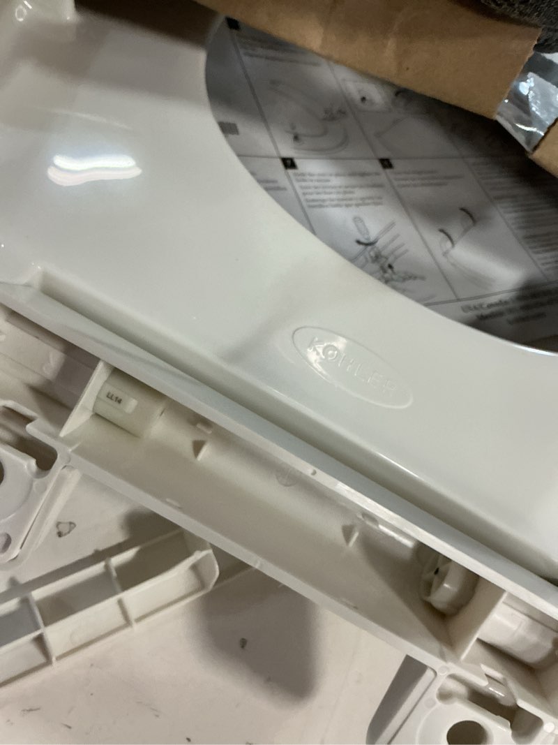 Condition photo showing As Is for kohler k-20110-0 brevia elongated toilet seat with grip-tight bumpers, quiet-close seat, quick-attach hardware, white