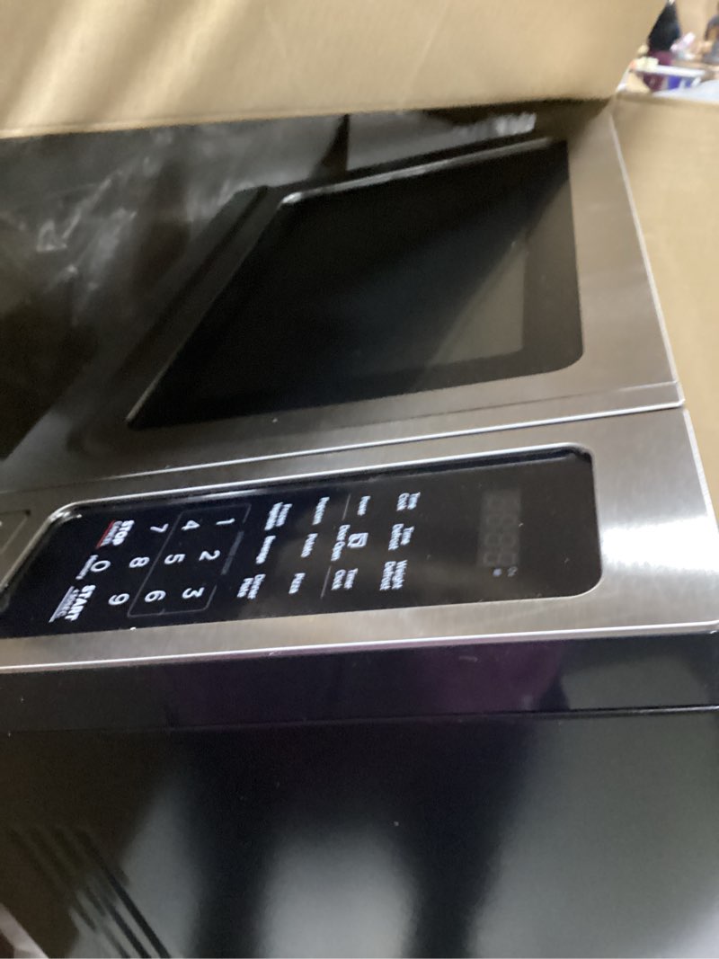 Condition photo showing As Is for **AS IS** (broken roller)BLACK+DECKER EM036AB14 Digital Microwave Oven with Turntable Push-Button Door, Child Safety Lock, Stainless Steel, 1.4 Cu.ft 1.4 Cu.Ft Stainless Steel