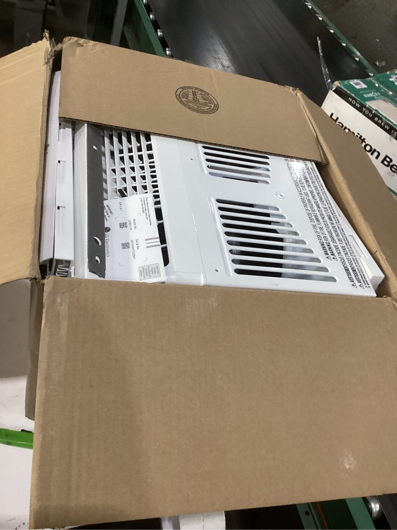 Condition photo showing As Is for lg 6,000 btu window air conditioner, 115v, cools 250 sq.ft. for bedroom, den, living room, quiet operation, with remote, 2 cooling & fan speeds, 2-way air deflection, auto restart, white 6000 btu electronic & standard white