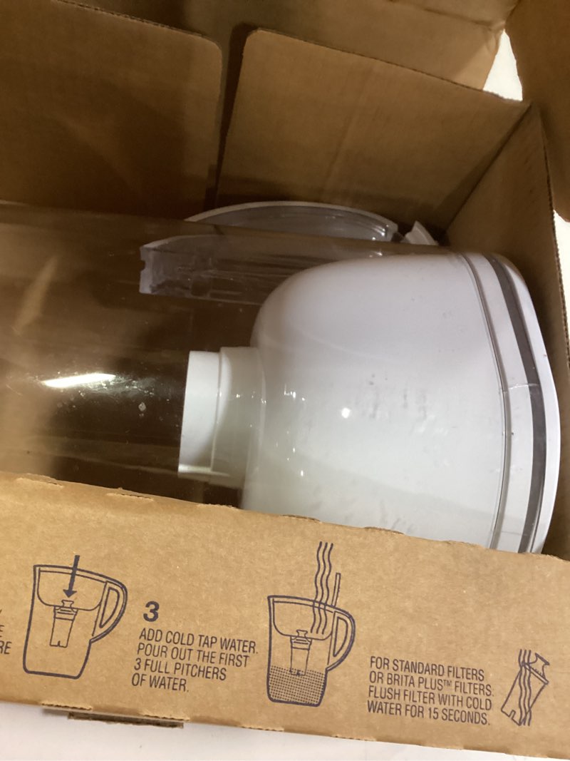 Condition photo showing As Is for brita water pitcher, everyday elite filter, removes 99% of lead, includes 1 filter, 10-cup capacity, white