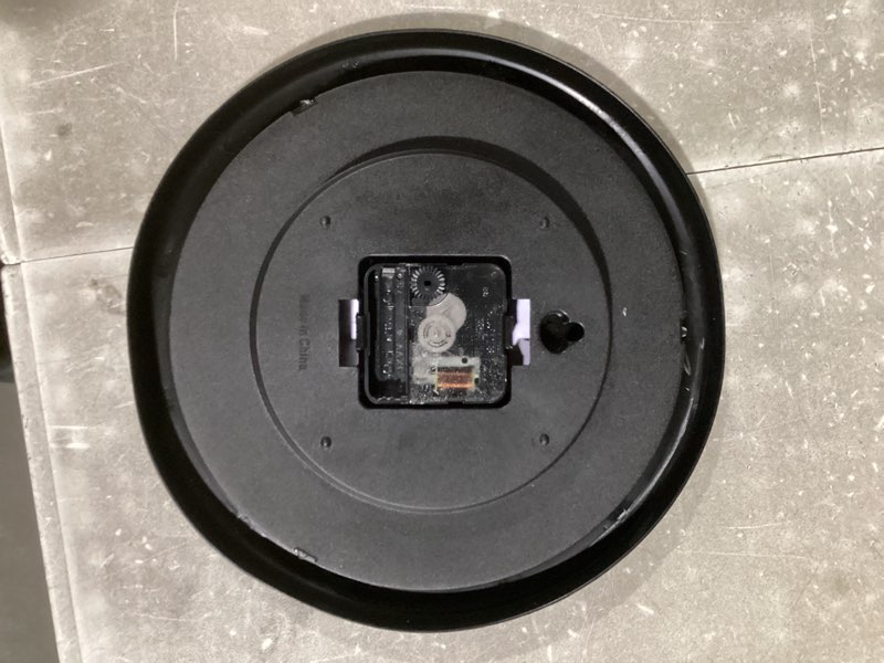 Condition photo showing As Is for signmission ish wall clock late tardy time around kind of almost gag gift