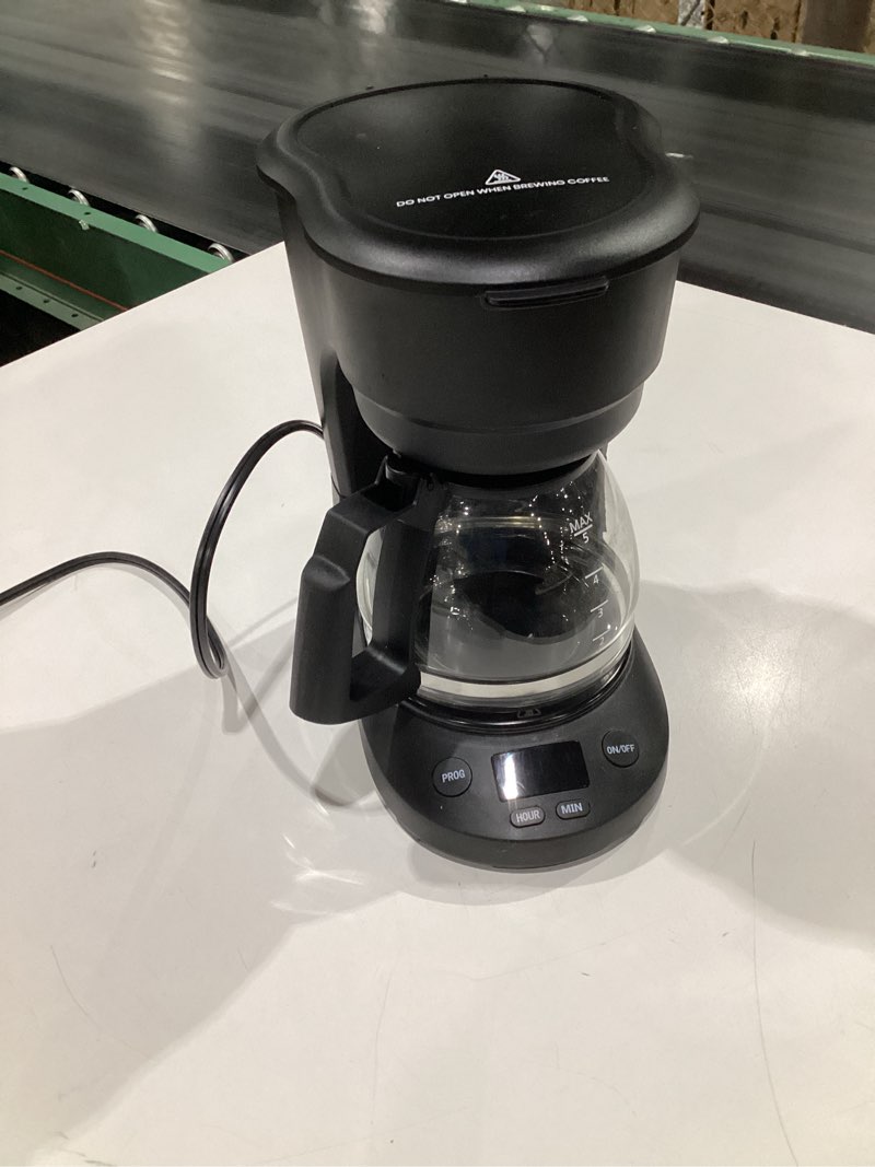 Condition photo showing As Is for (used, not tested) compact 5-cup programmable drip coffee maker — the essential coffee machine with digital clock, 24-hour timer, auto shut-off, and a removable filter basket for home & office.
