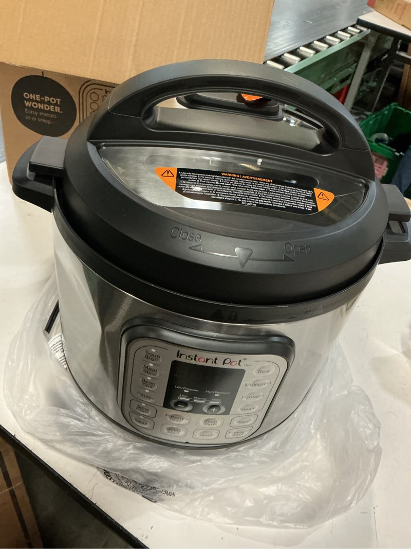 Condition photo showing As Is for instant pot duo 7-in-1 electric pressure cooker, slow cooker, rice cooker, steamer, sauté, yogurt maker, warmer & sterilizer, includes app with over 800 recipes, stainless steel, 8 quart