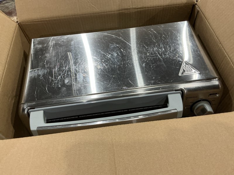Condition photo showing As Is for black+decker 4-slice toaster oven, to1745ssg-1a, even toast, 4 cooking functions bake, broil, toast and keep warm, removable crumb tray, timer