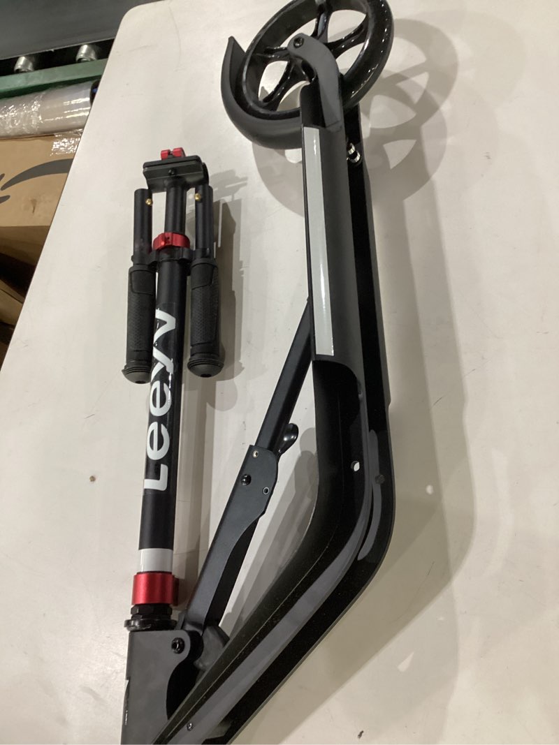 Condition photo showing As Is for adult scooter with big wheels | adjustable height, foldable aluminum frame | smooth ride for urban commuting and outdoor fun | suitable for teens 8-12 | 220 lbs weight limit 230-black