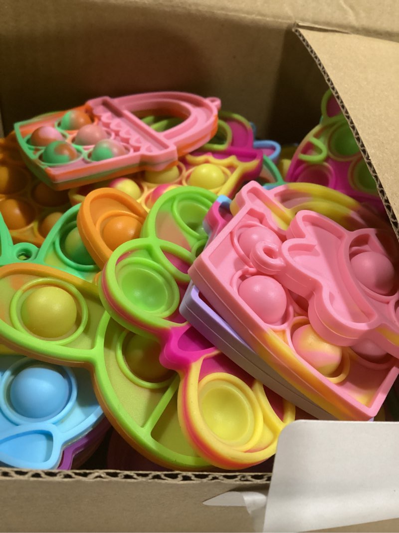 Condition photo showing As Is for 84pcs easter party favors for kids,easter egg fillers basket stuffers,fidget toys bulk its birthday gifts for toddlers adult,classroom prizes box,goodie bag stuffers,treasure chest toy,bubbles poppers