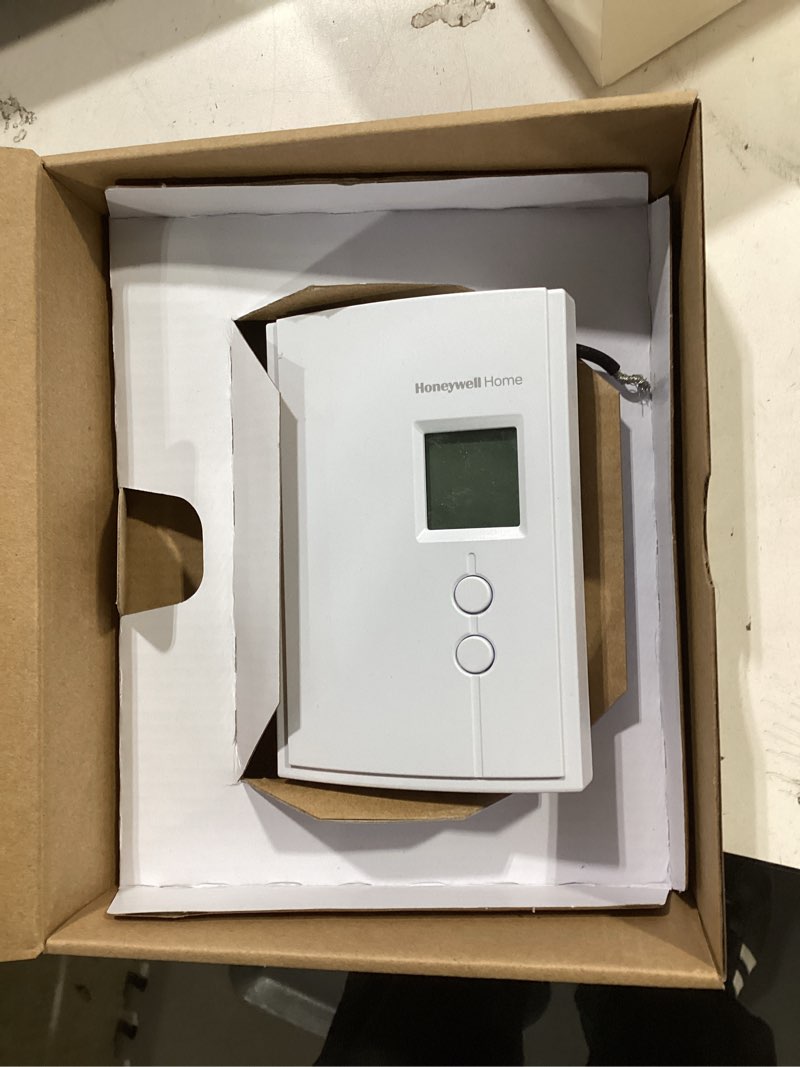 Condition photo showing As Is for Honeywell Home RLV3120A1005 Digital Non-Programmable Thermostat for Electric Heat Only