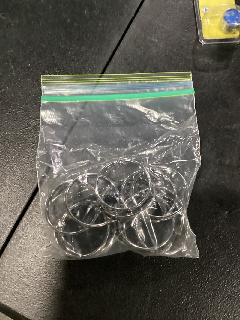 Condition photo showing As Is for set of 12 shower curtain rings.  dont stay closed very well.