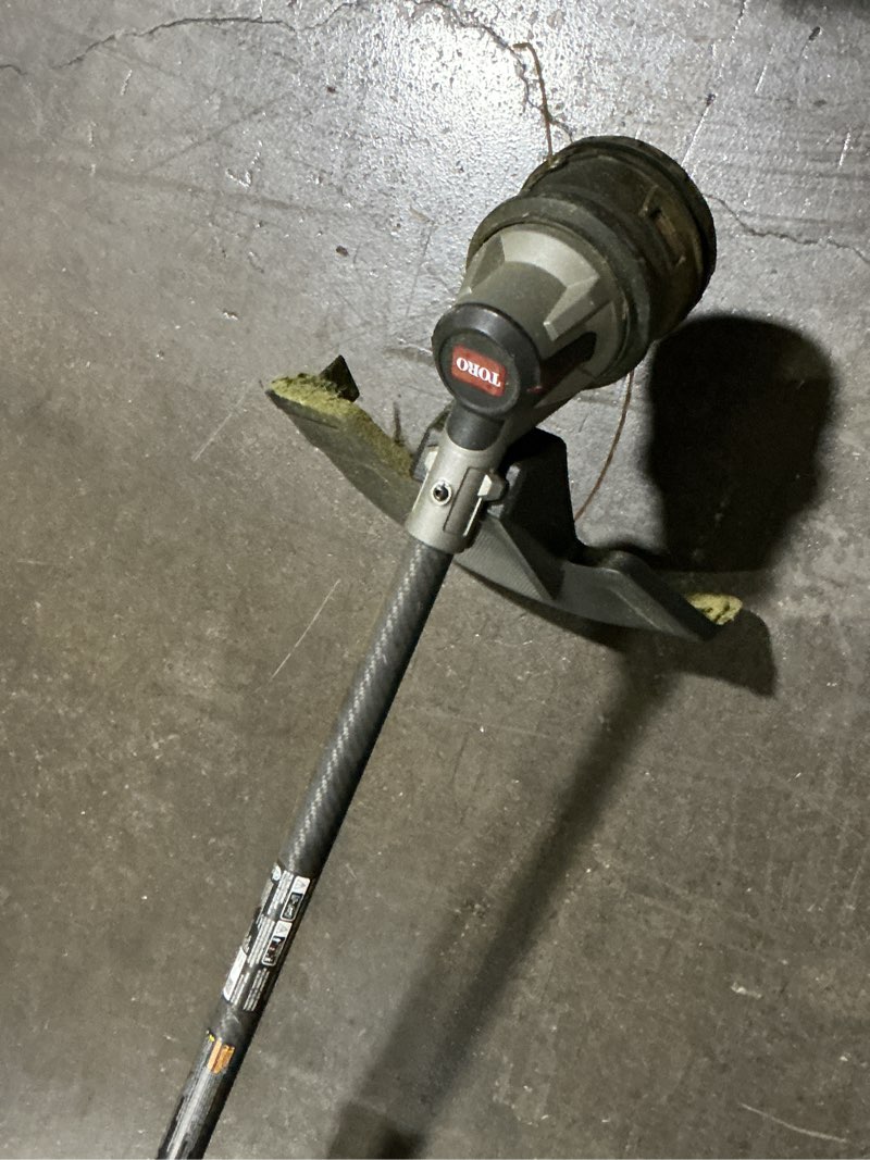 Condition photo showing As Is for toro flex-force 17-in telescopic shaft battery string trimmer only