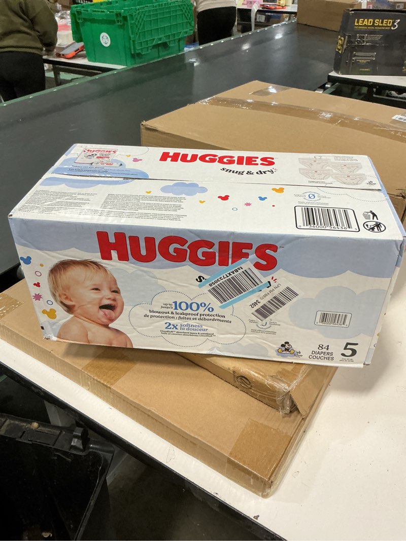 Condition photo showing New/Like New for Huggies Size 5 Diapers, Snug & Dry Baby Diapers, Size 5 (27+ lbs), 84 Count, Packaging May Vary Size 5 84