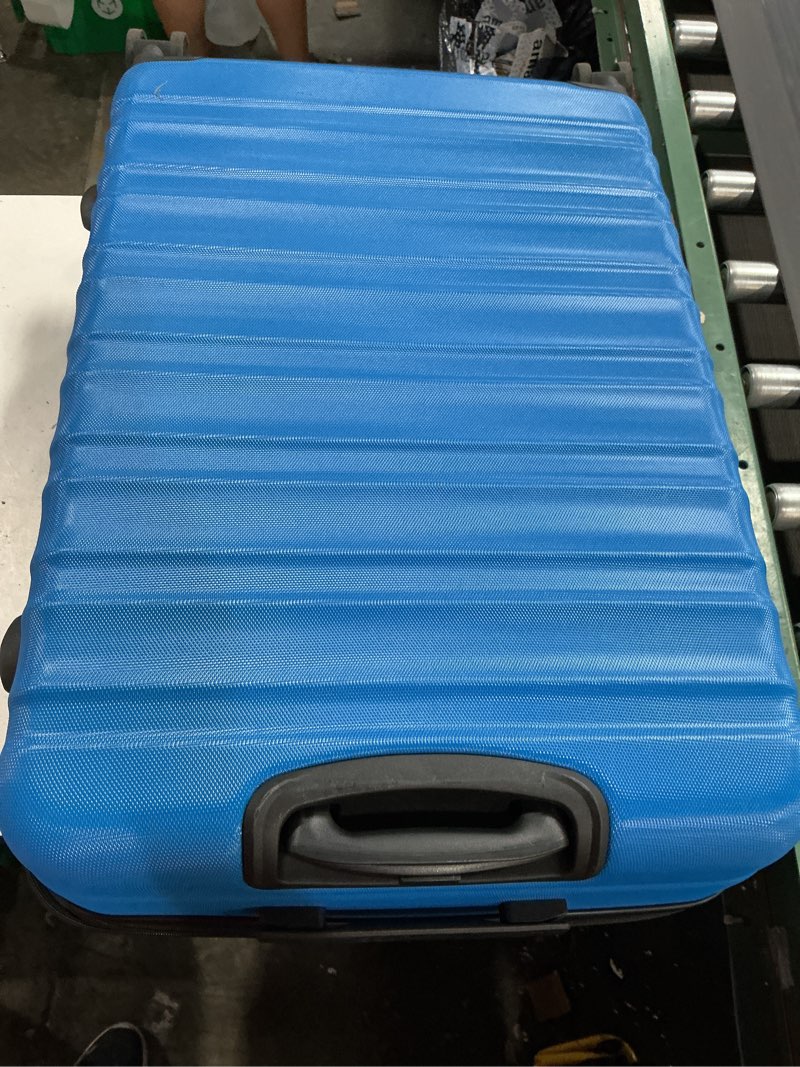 Condition photo showing Good Condition for amazon basics 30" hardside large checked luggage, expandable for up to 15% more space, with scratch-resistant surface, four multi-directional wheels, telescoping handle, light blue light blue large checked