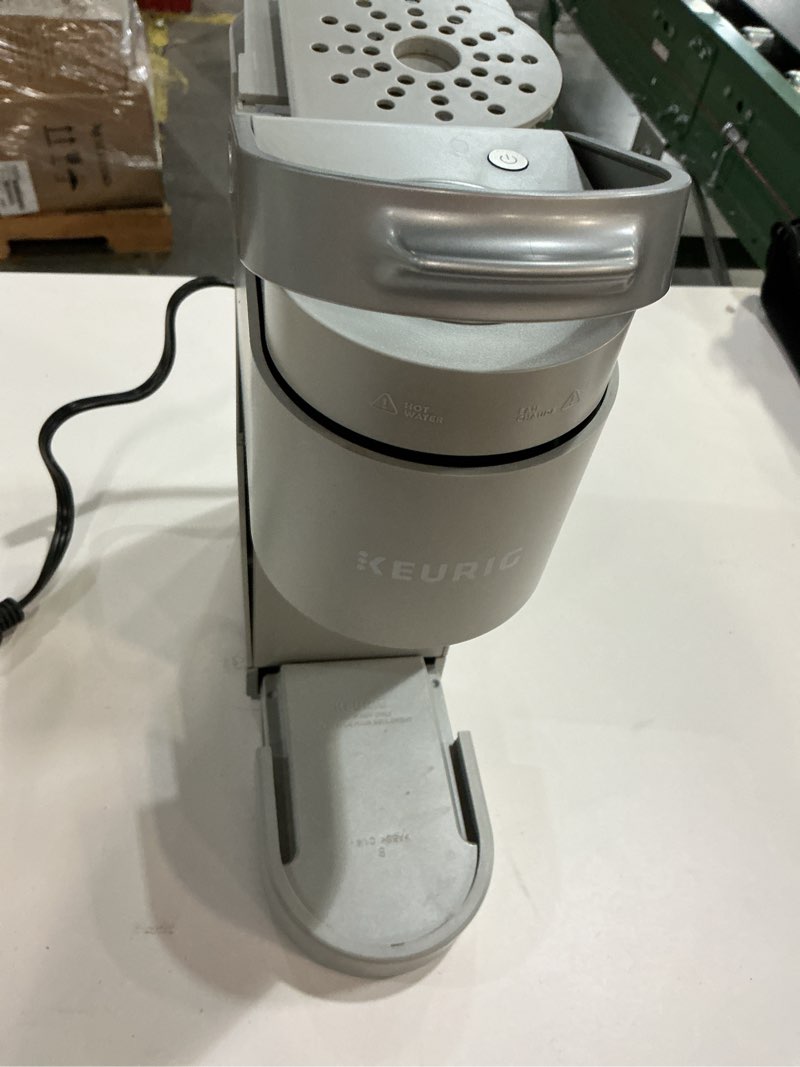 Condition photo showing As Is for Keurig K-Mini Single Serve K-Cup Pod Coffee Maker, 6 to 12oz Brew size, with Cord Storage, Perfect for Small Spaces, Studio Gray