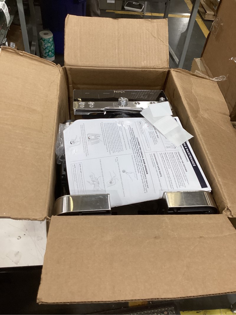 Condition photo showing As Is for ninja luxe café 3-in-1 espresso, drip coffee and cold brew machine | integrated coffee grinder, milk frother, assisted tamper & built-in espresso accessory storage | stainless steel | es601 luxe cafe stainless steel