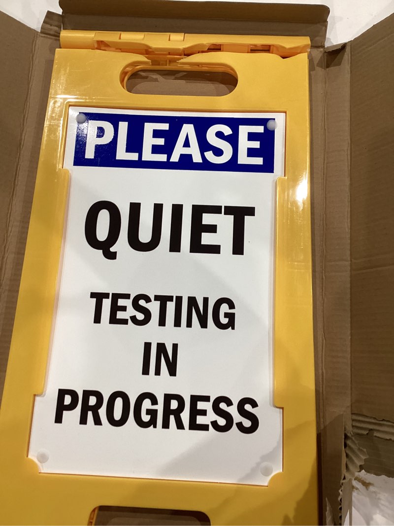 Condition photo showing As Is for smartsign "please quiet - testing in progress" folding floor sign | 25" x 12" plastic black/blue on white