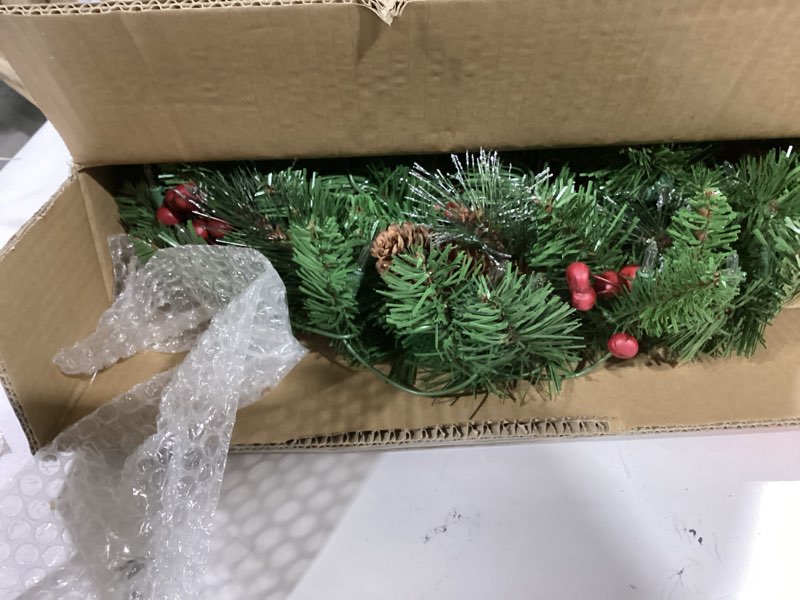 Condition photo showing Good Condition for National Tree Company 24 in Pre-Lit Crestwood Spruce Artificial Christmas Wreath, Christmas Decoration with Glitter, Pinecones, Red Berries, 50 Clear Lights, 160 Tips, Green 24 in Plug In Wreath
