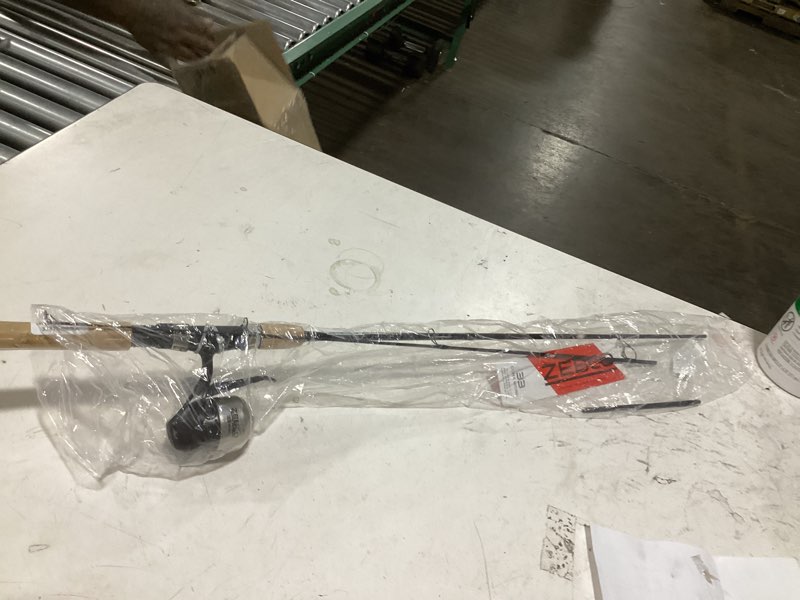 Condition photo showing As Is for zebco 33 cork reel and fishing rod combo, graphite rod with cork handle, quickset anti-reverse fishing reel with bite alert 6 foot - spincast