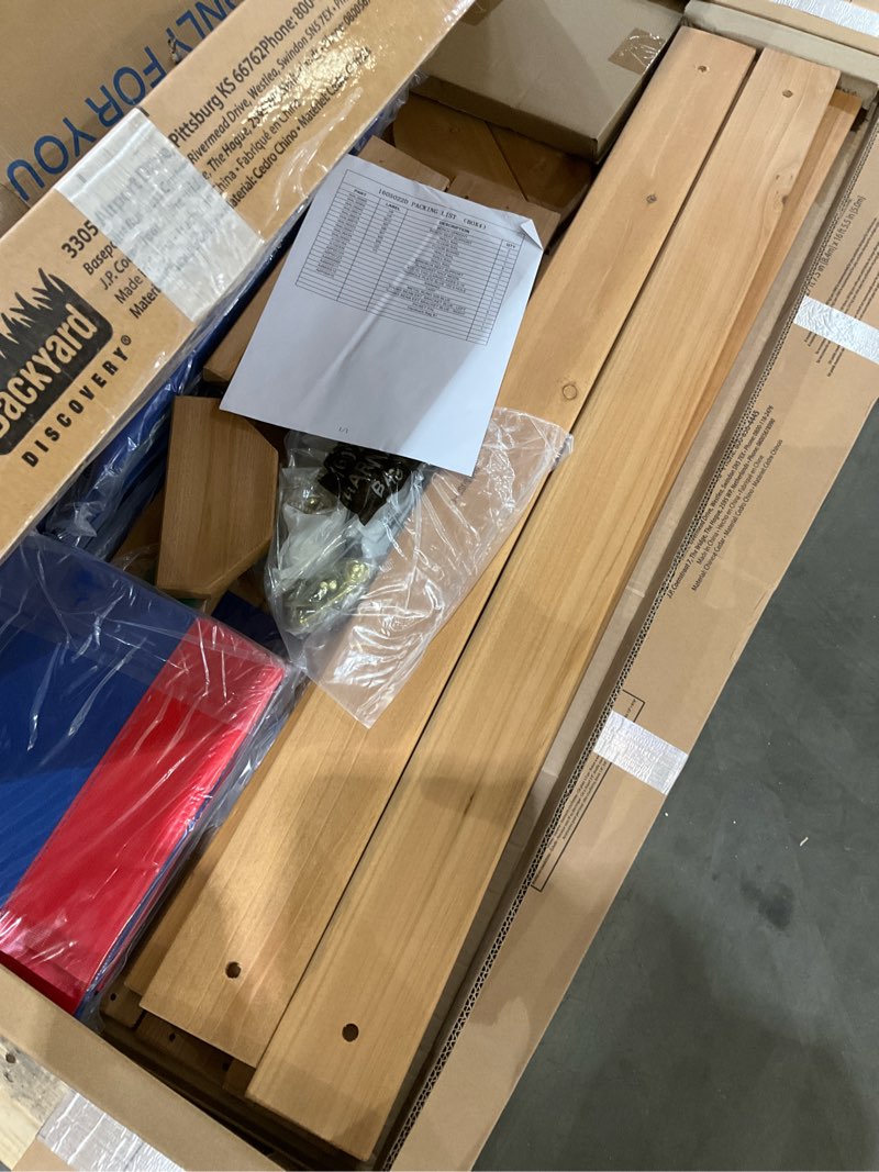 Condition photo showing Good Condition for backyard discovery beach front cedar wood swing set with wave slide, play deck, monkey bars, rock wall ladder, shaded picnic area, snack bar, belt swings, trapeze, sandbox area, outdoor playset multicolor large