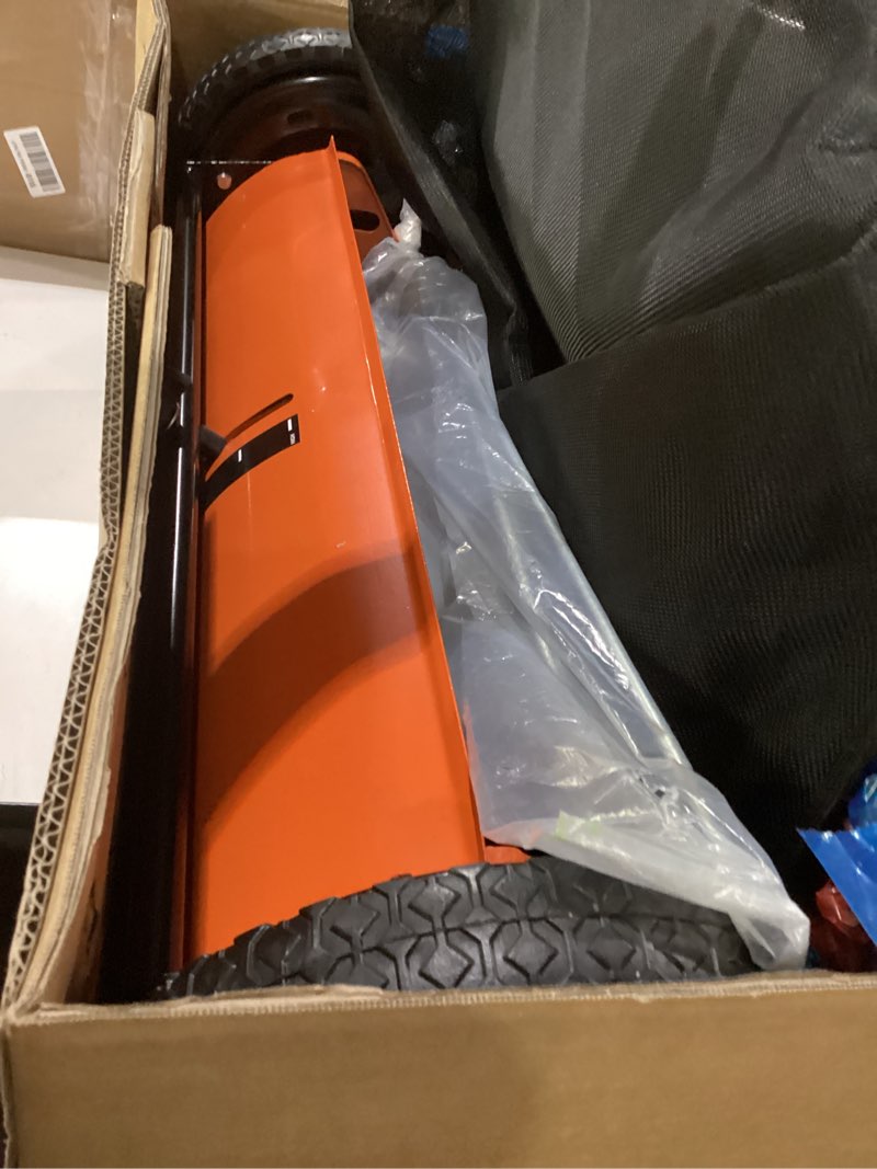 Condition photo showing New/Like New for not tested push lawn sweeper, 26-inch width, 7 cu. ft. hopper capacity, 4 spinning brushes, adjustable height, durable steel frame with rubber wheels, orange 26\" orange