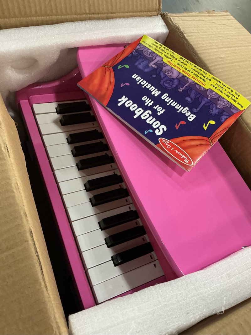 Condition photo showing Good Condition for melissa & doug learn-to-play pink piano with 25 keys and color-coded songbook