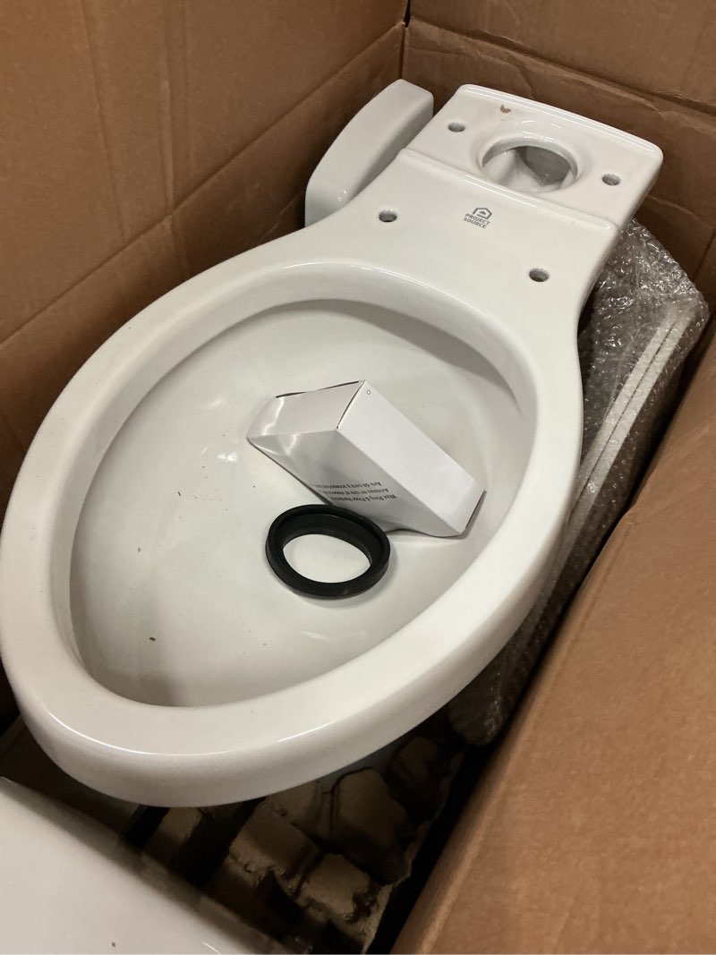 Condition photo showing As Is for project source pro-flush white elongated chair height 12-in rough-in watersense 1.28 gpf 2-piece toilet