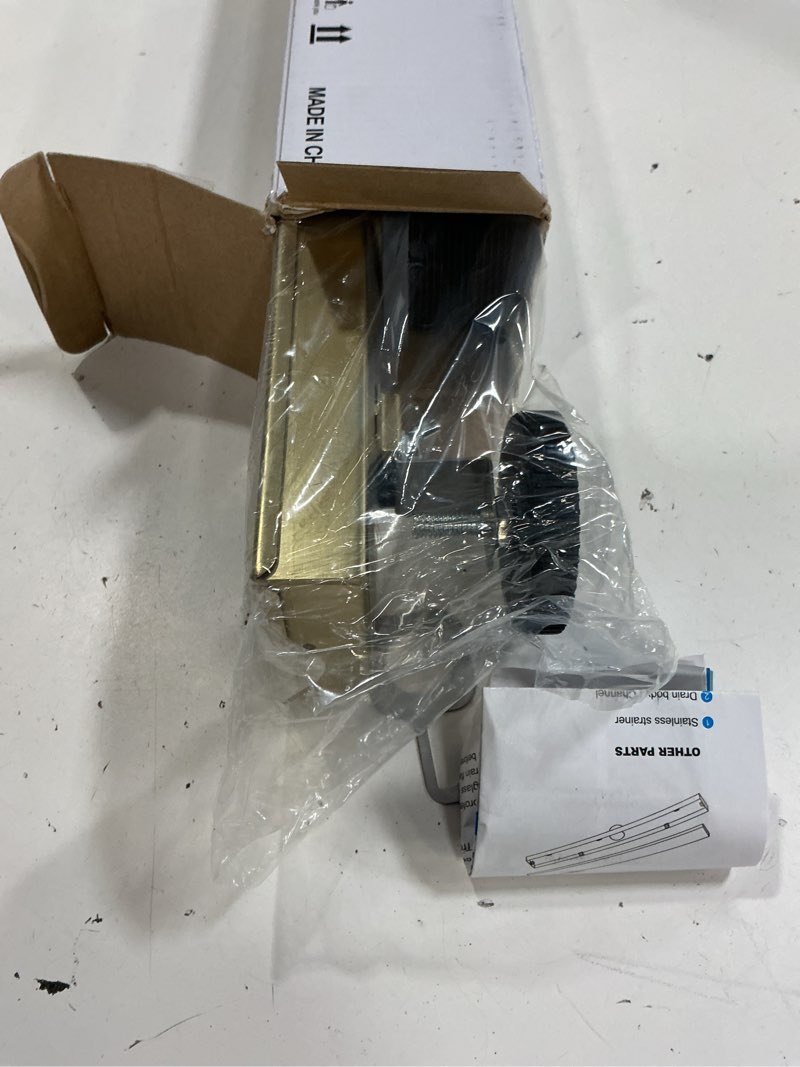 Condition photo showing Good Condition for 12 inch linear shower drain - brushed gold 304 stainless steel rectangular floor drain with adjustable leveling feet, hair strainer and removable grate brushed gold 12 inch