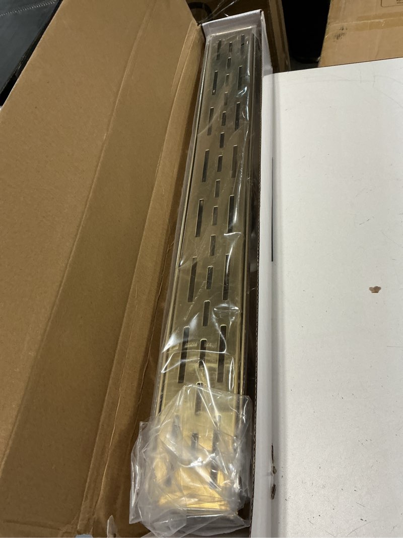 Condition photo showing Good Condition for WEBANG 24 Inch Linear Shower Drain Rectangular Floor Drain with Accessories Rainline Pattern Cover Grate Removable SUS304 Stainless Steel CUPC Certified Brushed Gold Brushed Gold 24 Inch