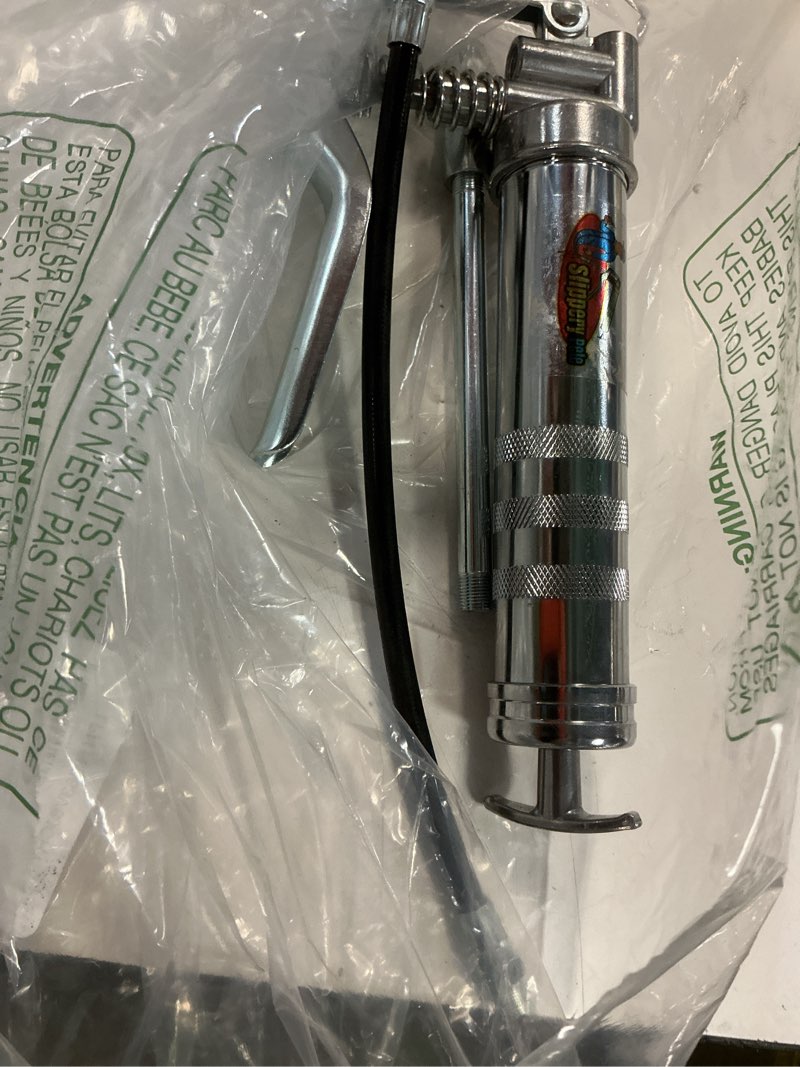 Condition photo showing Good Condition for slippery pete mini pistol grip grease gun. heavy duty design for 3oz cartridges. 12 inch flexible hose and 5 inch rigid extension pipe