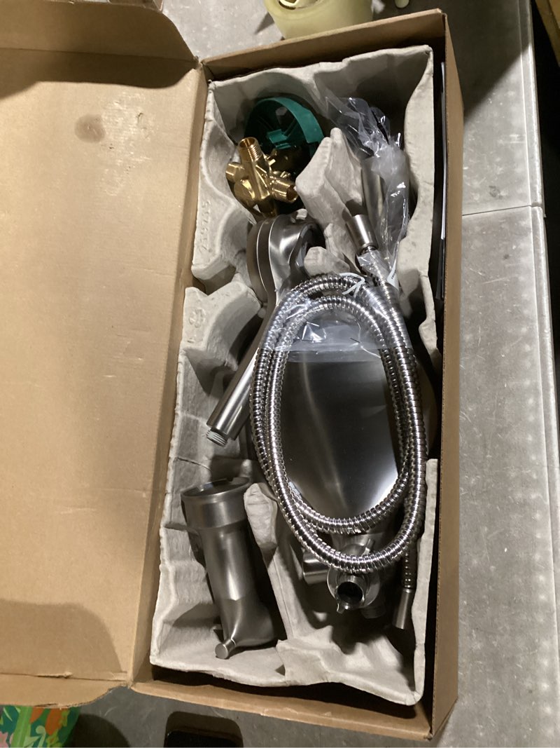 Condition photo showing As Is for moen engage multi-function handshower and rainfall shower head trim combo with handle, tub spout, metal hose and valve, brushed nickel, 82304srn