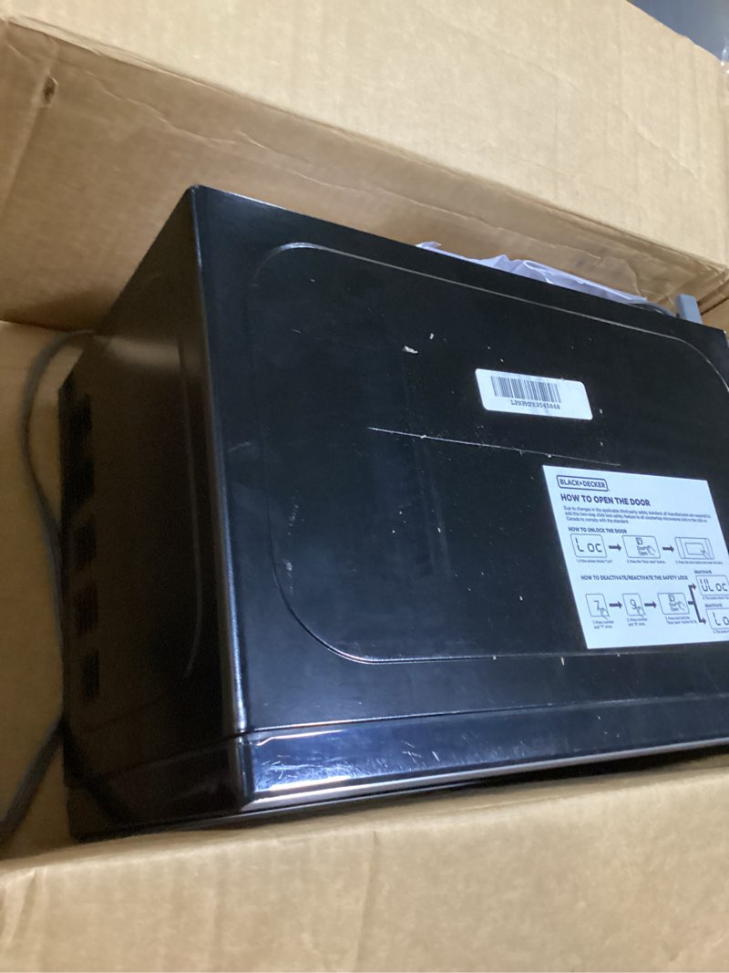 Condition photo showing As Is for BLACK+DECKER EM720CB7 Digital Microwave Oven with Turntable Push-Button Door, Child Safety Lock, 700W, Stainless Steel, 0.7 Cu.ft 0.7 cu. ft.