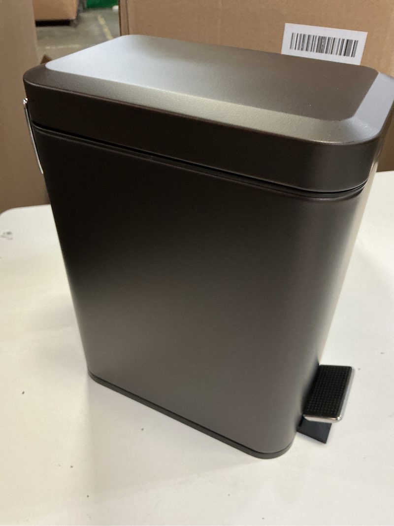 Condition photo showing New/Like New for mdesign small modern 1.3 gallon rectangle metal lidded step trash can, compact garbage bin with removable liner bucket and handle for bathroom, kitchen, craft room, office, garage - bronze bronze 1.3 gallon