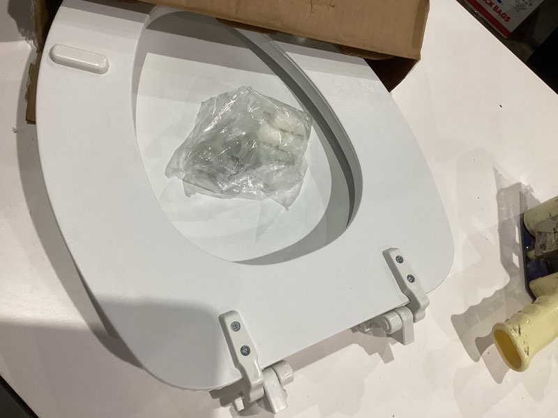 Condition photo showing Good Condition for Mayfair Padded Toilet Seat, Cushioned Soft Vinyl over Wood Core Seat, Secure Hinges, Easy Clean, Made in USA, Elongated, White Elongated White Toilet Seat