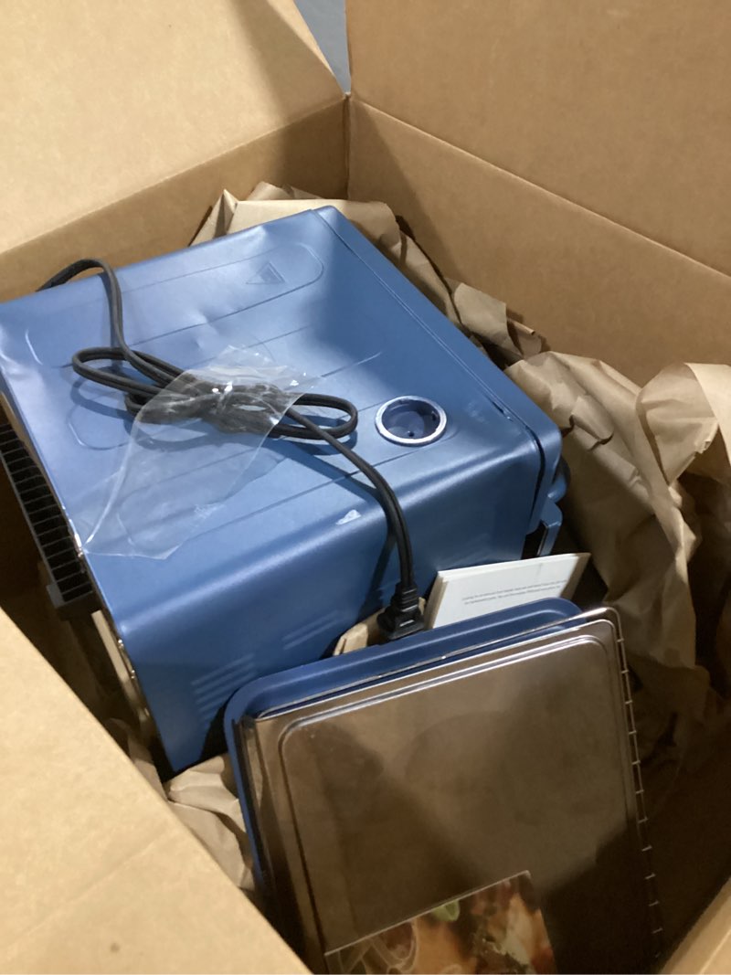 Condition photo showing Good Condition for our place wonder oven | 6-in-1 stainless steel air fryer toaster oven combo with basket, rack, pan & tray | compact 13 qt countertop capacity - toast, roast, bake, reheat, broil & steam | blue salt 12.7 quarts blue salt