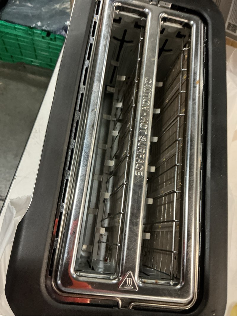 Condition photo showing As Is for elite gourmet ect5322 long slot 4 slice toaster, countdown timer, bagel function 6 toast setting, defrost, cancel function, built-in warming rack, extra wide slots for bagels waffles, stainless steel 4-slice black & stainless steel