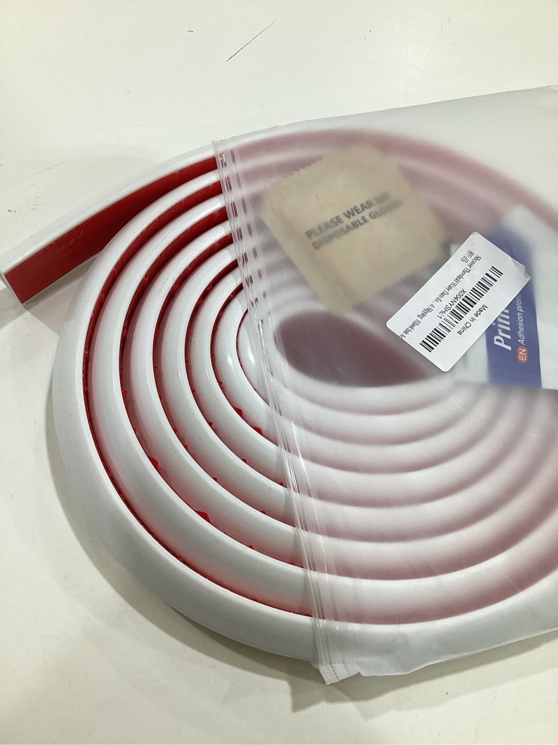 Condition photo showing Good Condition for collapsible shower threshold water dam - self-adhesive silicone barrier for wet-dry separation - flexible splash guard for walk-in showers, bathroom floor, & kitchen sink - ada accessible profile 138inch white