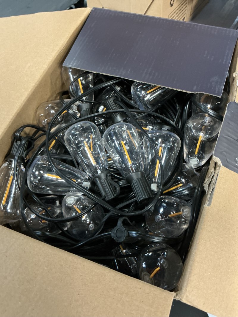 Condition photo showing Good Condition for ollny 155ft outdoor string lights, shatterproof connectable patio lights with 60 st38 edison led bulbs, 2200k warm white waterproof string lights for outside backyard, gazebo, porch, balcony, bistro