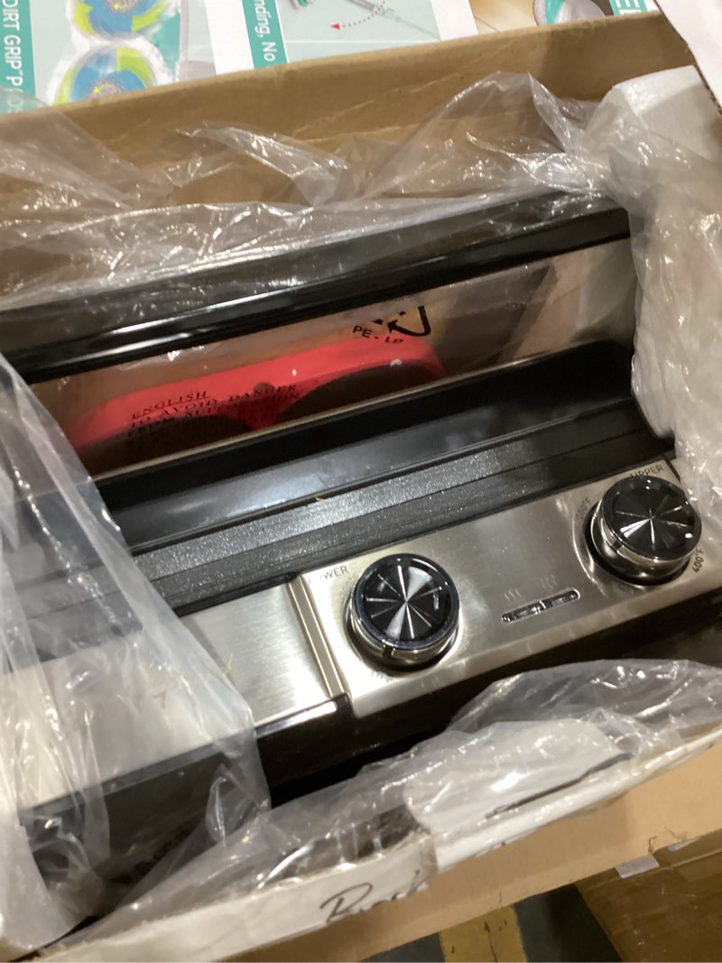 Condition photo showing Good Condition for baker's friend 4-slice panini press grill cheese sandwich maker, electric grill indoor with temperature setting, opens 180 degrees, dual non-stick surfaces, 4-circle silicone mold, reversible plates silver