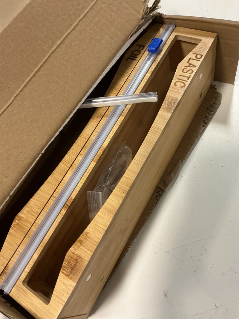 Condition photo showing Good Condition for 6 in 1 storage bag organizer kitchen drawer, bamboo foil and plastic wrap dispenser with slider cutter, kitchen bag organizer for quart, gallon, sandwich and snack bags natural bamboo