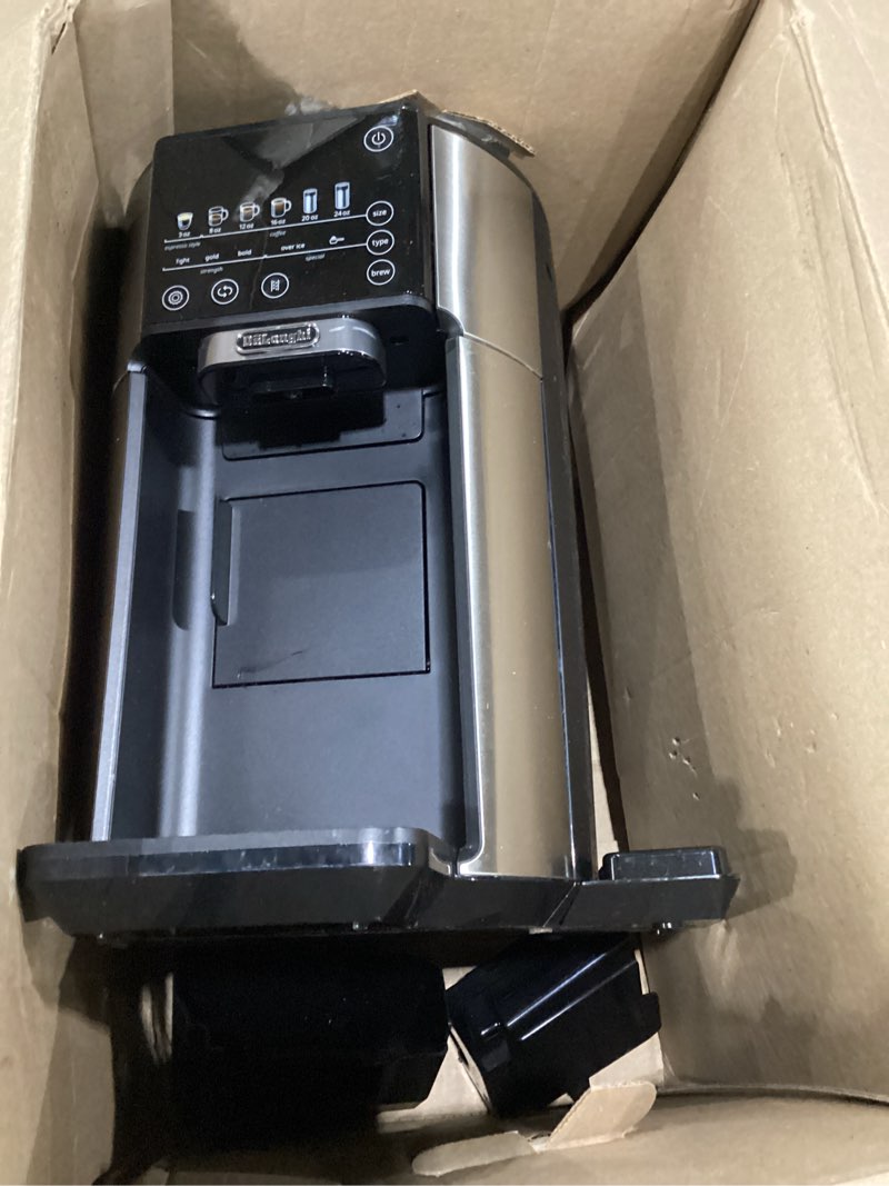 Condition photo showing As Is for *not tested* De'Longhi True Brew Drip Coffee Maker, Built in Grinder, Single Serve, 8 oz to 24 oz, Hot or Iced Coffee, Stainless, CAM51025MB