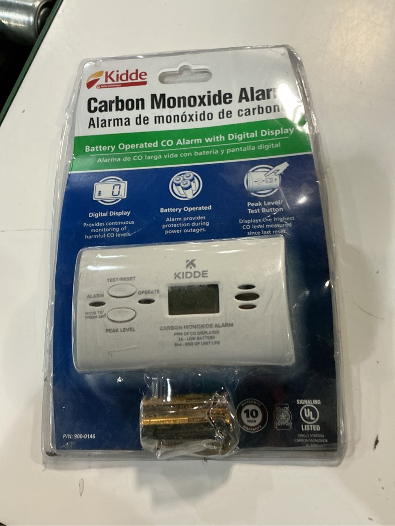 Condition photo showing As Is for kidde carbon monoxide detector, aa battery powered co alarm with leds, test-reset button, low battery indicator, portable