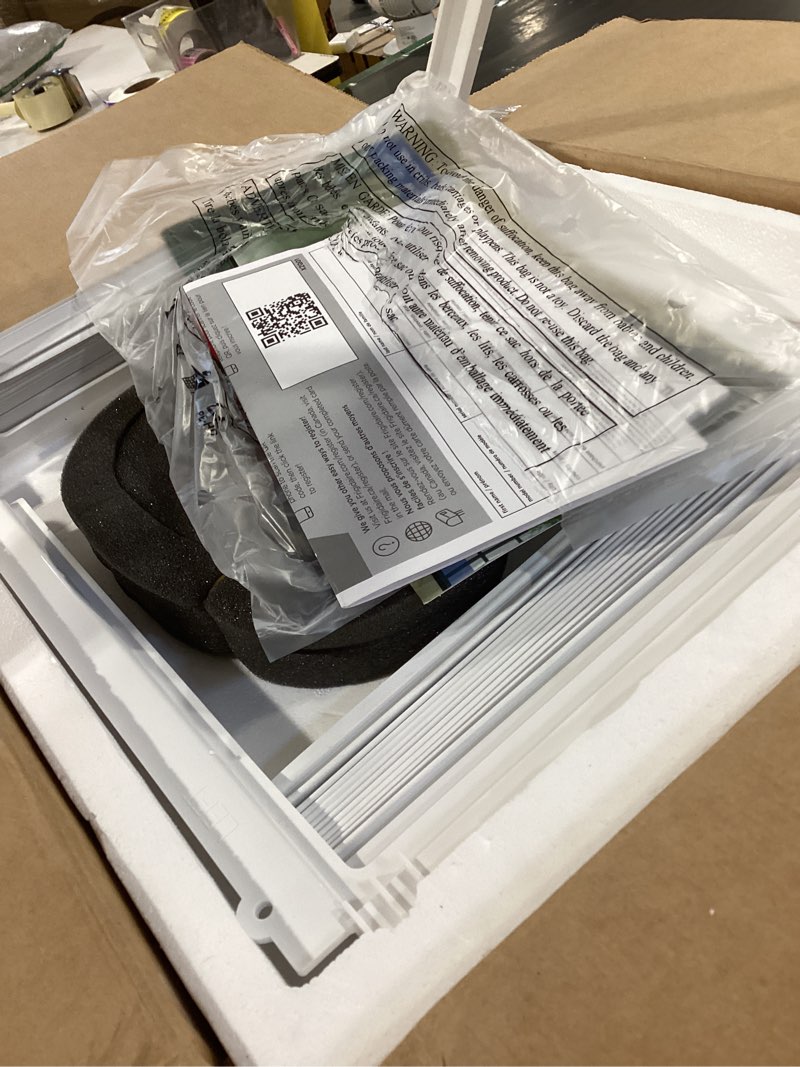 Condition photo showing As Is for frigidaire 5,000 btu window-mounted air conditioner, cools up to 150 sq. ft., quiet operation, effortless temperature control, 2 fan speeds, auto restart, white 5,000 btu mechanical controls