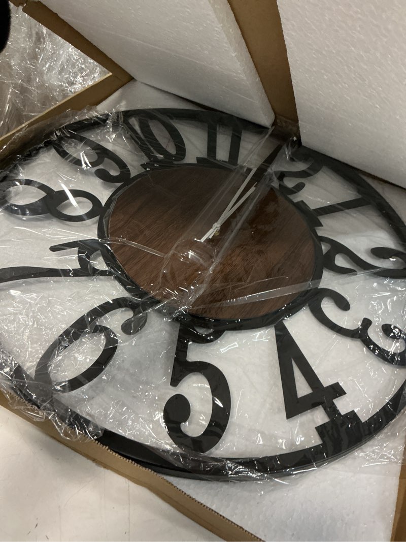 Condition photo showing Good Condition for Maxstar Large Round Wall Clock for Living Room Decor Battery Operated Non Ticking Black Metal Wood Clocks for Home Living Room Garden Farmhouse Office Kitchen Decoration -24 inch Black-arabic Numerals 24 Inch