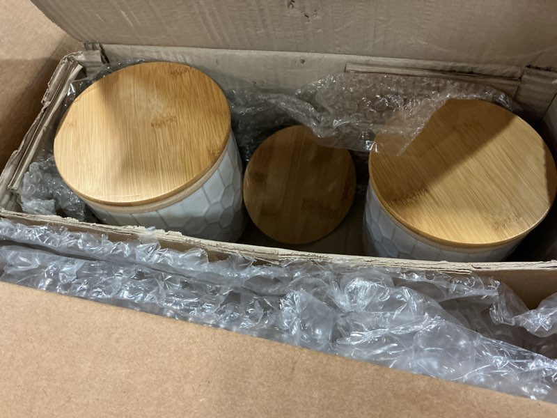 Condition photo showing Good Condition for (2pcs) 100 north honeycomb design with wood lid, white 5.5 x 4 inches glazed ceramic canister jar; set of 2