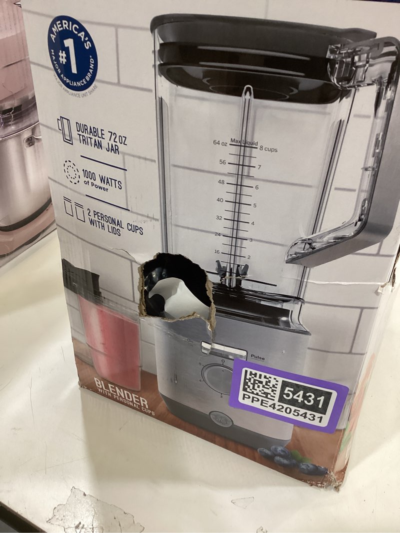 Condition photo showing As Is for ge 5-speed blender + (2) 16 ounce blender cups | kitchen essentials for shakes, smoothies & more | large 64 oz tritan jar, 8-10 servings | stainless steel blades & exterior finish| 1000 watts