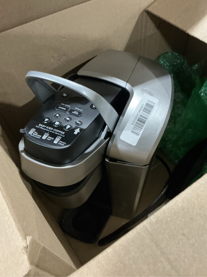 Condition photo showing As Is for keurig k-elite single serve k-cup pod coffee maker, with strength and temperature control, iced coffee capability, 8 to 12oz brew size, programmable, brushed silver